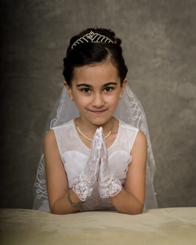 girl receiving her first holy communion